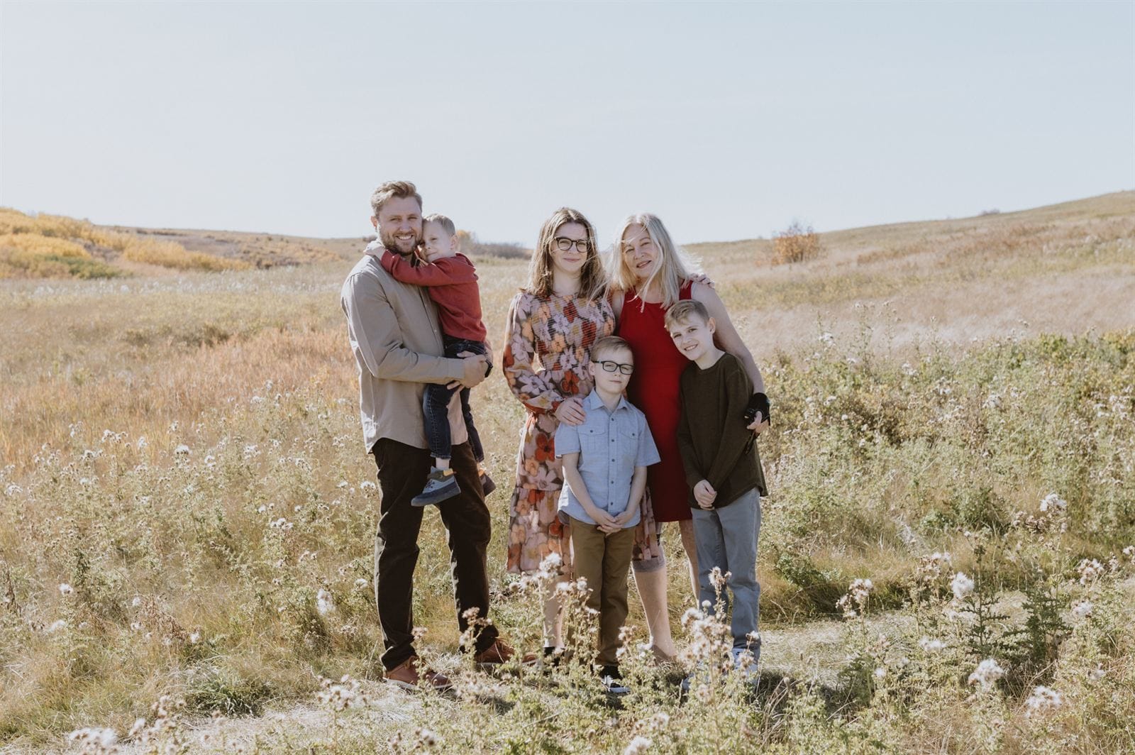 Jordan Hicks with his wife and three sons in a field